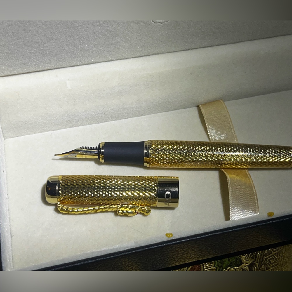 Gold and Black Luxury Fountain Pen with Intricate Dragon Detailing